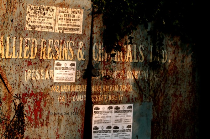 A chemical factory gate, Kolkata, near a small airport
